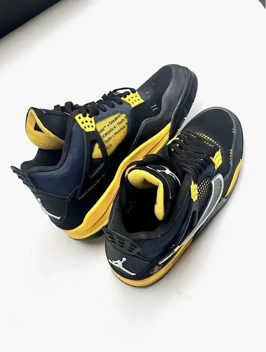 Black and yellow sneakers on a white background