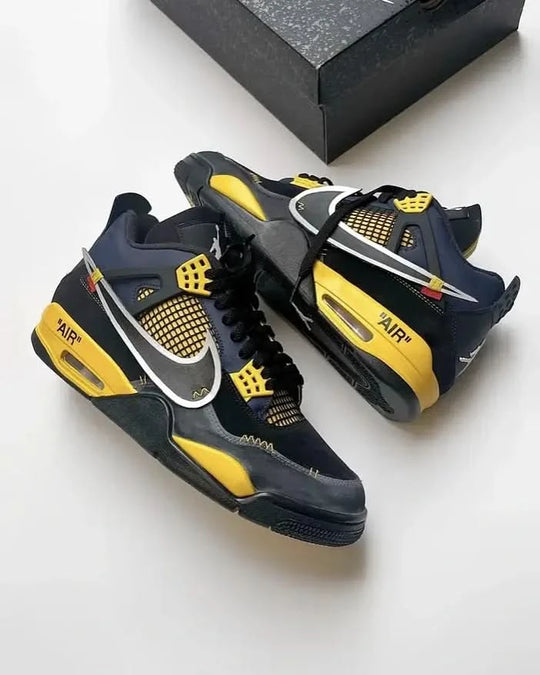 Custom Jordan 4 Dark Knight sneakers in midnight blue and yellow with oversized silver Swoosh and distressed asphalt toe.