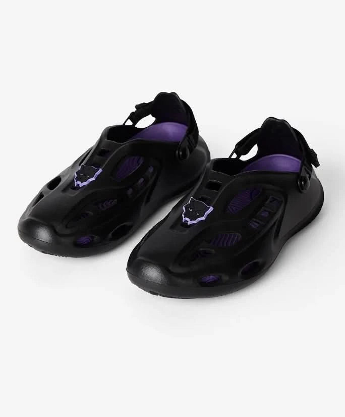 Black and purple sandals on a white background