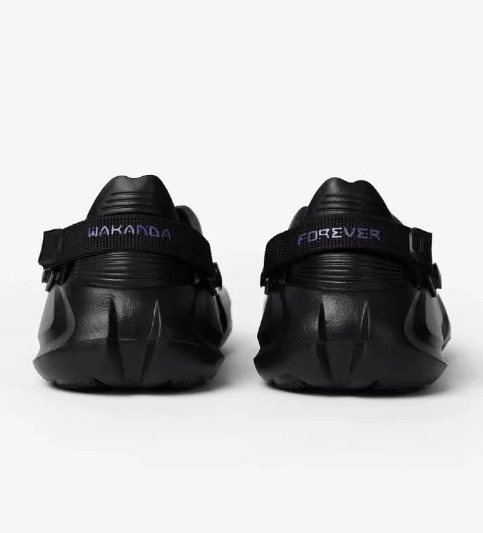 Black shoes with 'Wakanda Forever' text on a white background
