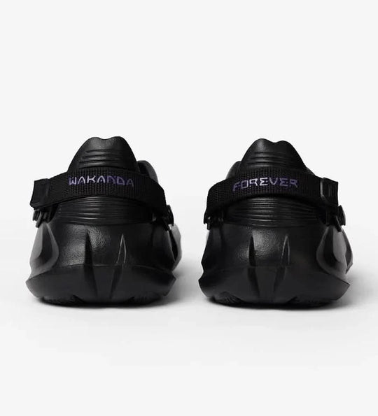 Black shoes with 'Wakanda Forever' text on a white background