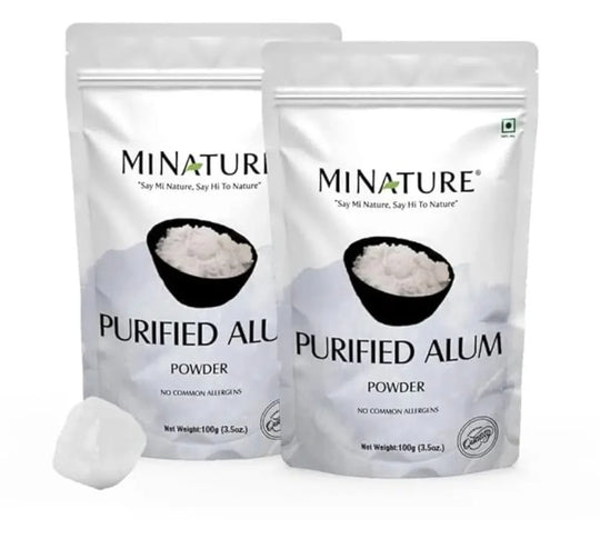 Two packages of Minature Purified Alum Powder on a white background