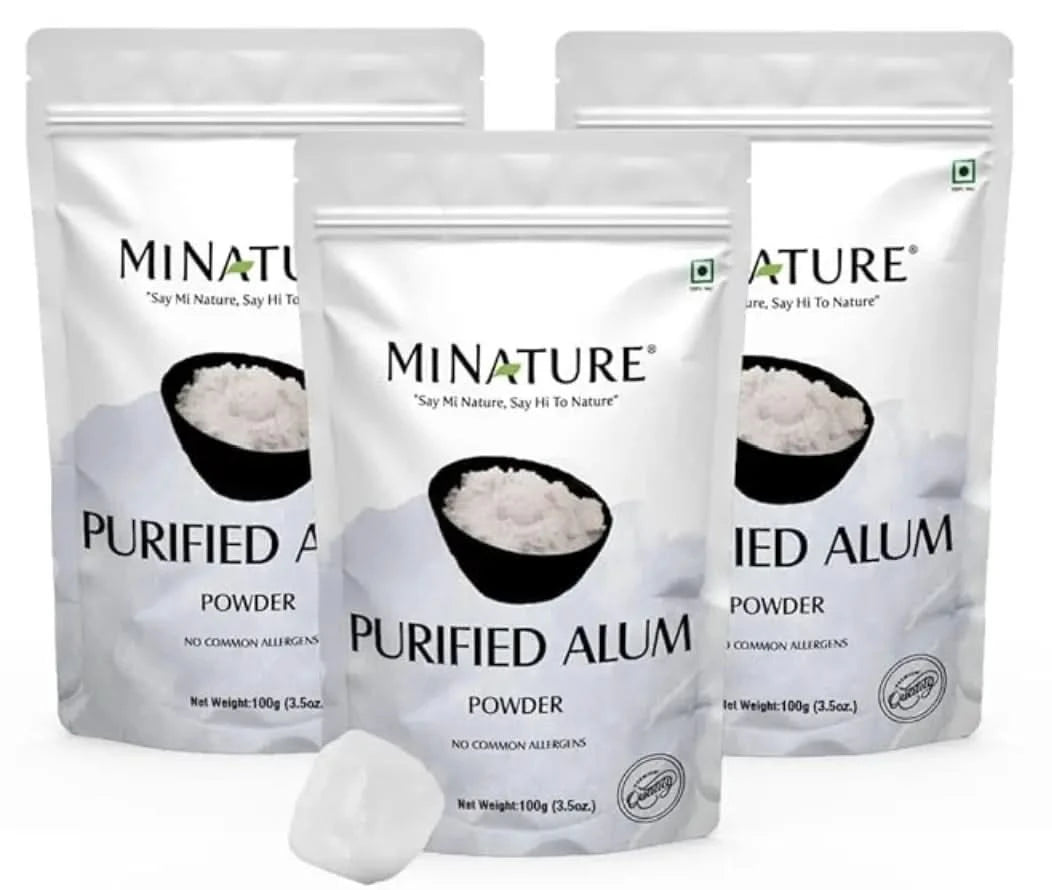 Three packages of Minature Purified Alum Powder on a white background