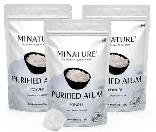 Three packages of Minature Purified Alum Powder on a white background