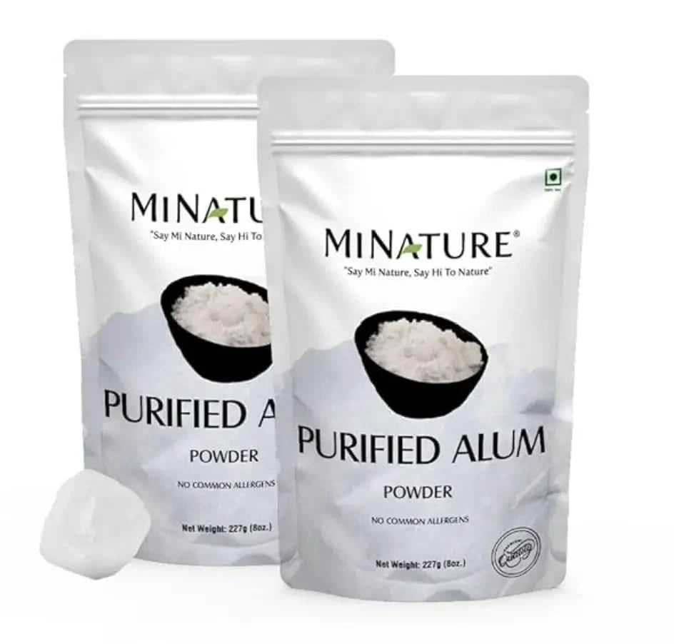 Two packages of Minature Purified Alum Powder on a white background