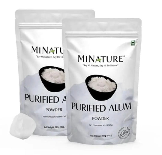Two packages of Minature Purified Alum Powder on a white background