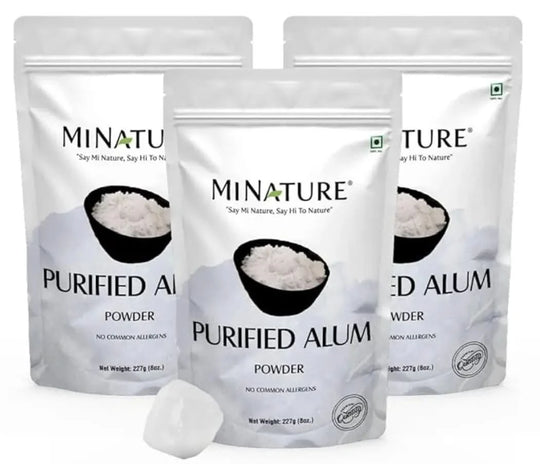 Three packages of Minature Purified Alum Powder on a white background