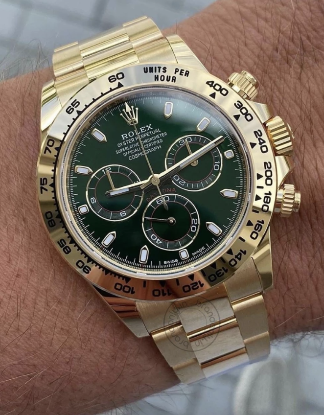 Rolex Oyster Perpetual RLX-116508 Chronograph gold stainless steel watch with green dial on wrist