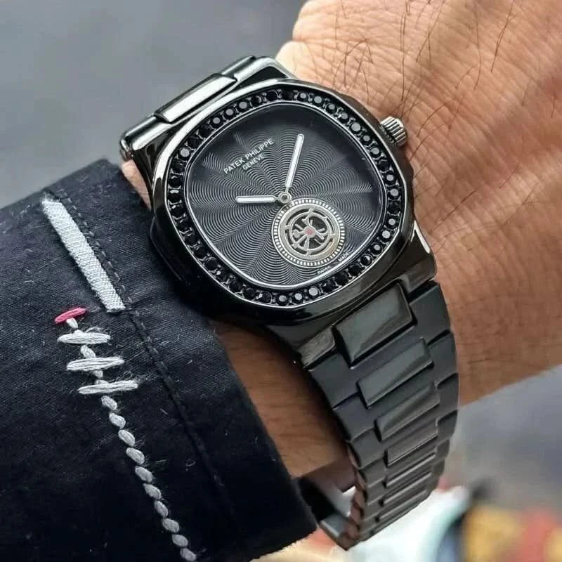 Patek Phillipe Nautilus luxury stainless steel watch with black dial and bracelet on wrist